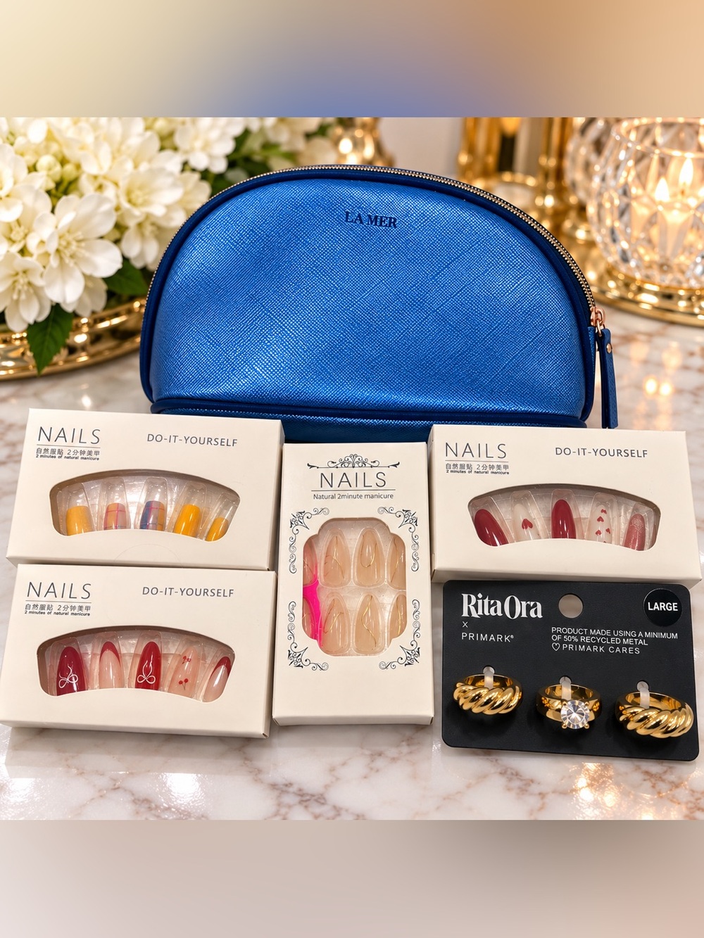 La Mer Metallic Blue Makeup Pouch with Nail Sets & Rita Ora Earrings